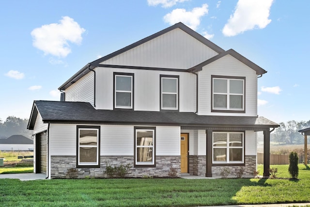 view of front of home with a front yard and covered porch