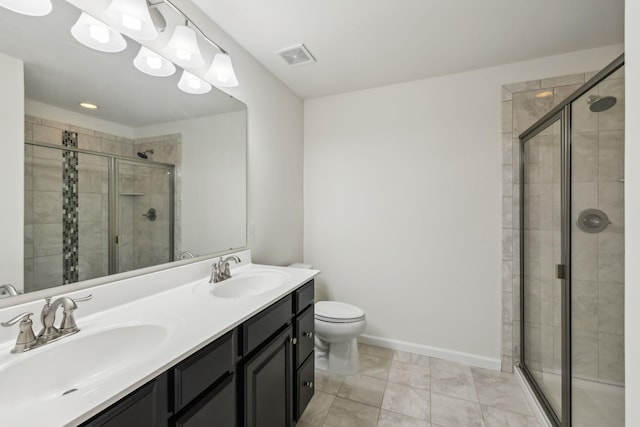 bathroom featuring a shower with shower door, tile patterned floors, and toilet