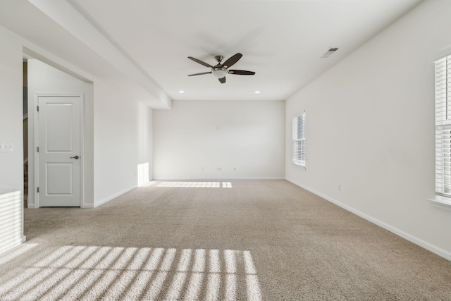 carpeted empty room with ceiling fan