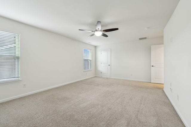 carpeted empty room with ceiling fan