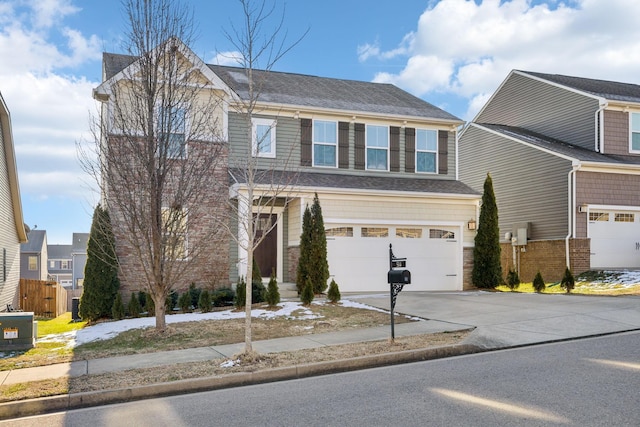 view of front of house featuring a garage and central AC