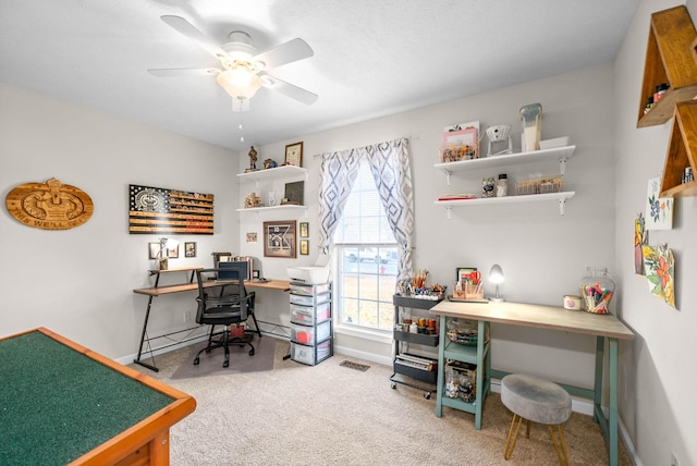 office space with ceiling fan, baseboard heating, and carpet floors