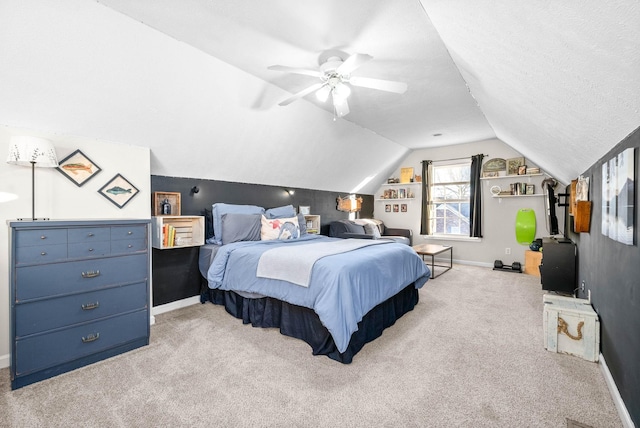 bedroom with ceiling fan, light colored carpet, a textured ceiling, and lofted ceiling