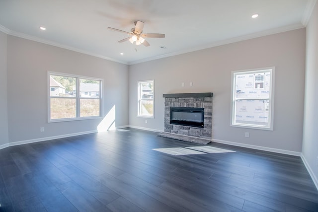 unfurnished living room featuring dark wood-type flooring, ornamental molding, and ceiling fan