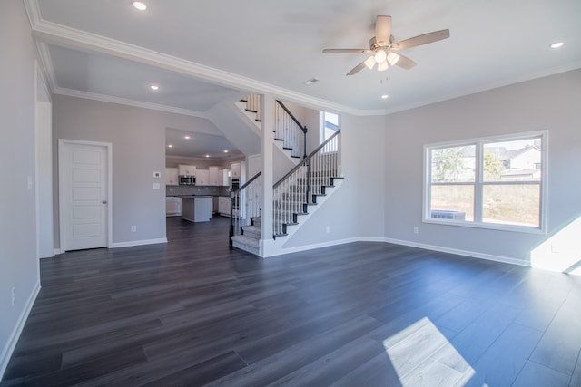 unfurnished living room featuring dark wood-type flooring, ceiling fan, and ornamental molding