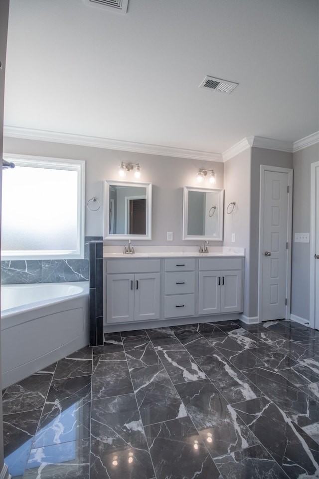 bathroom featuring a bath, ornamental molding, and vanity