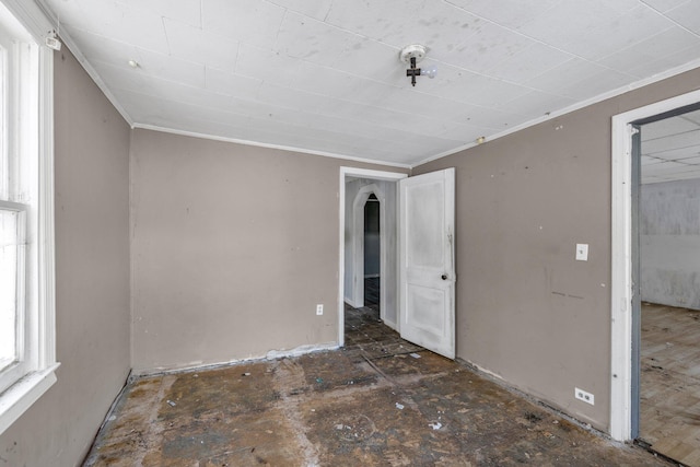 unfurnished bedroom featuring crown molding