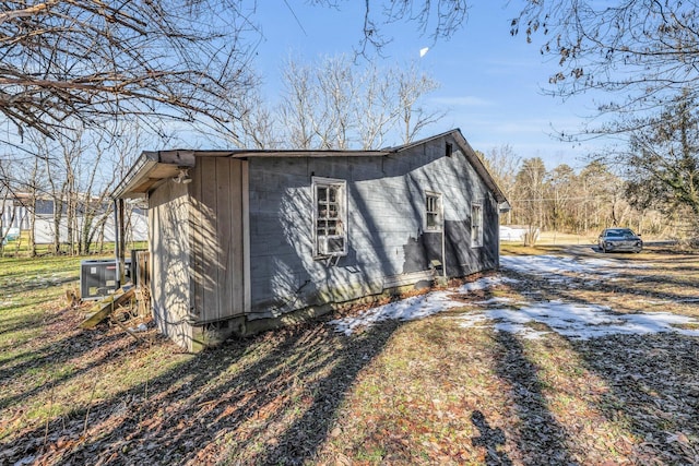 view of side of home featuring central AC