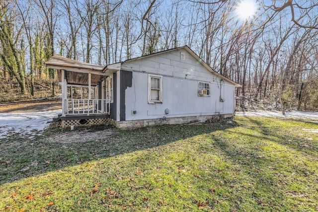 view of home's exterior with a yard