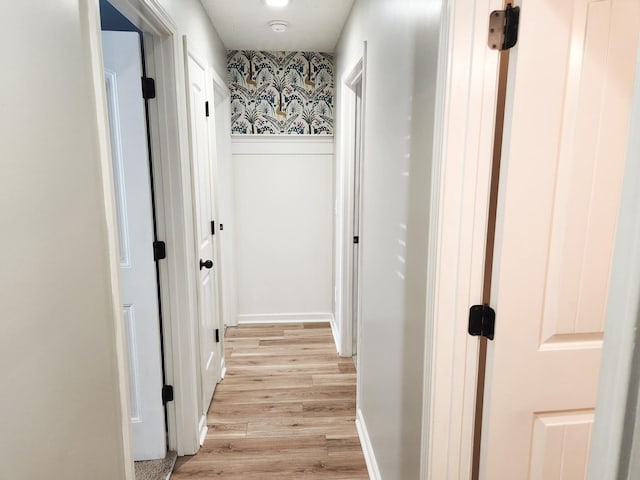 hall with light hardwood / wood-style floors