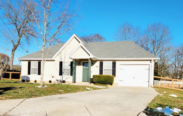 single story home featuring a front lawn and a garage