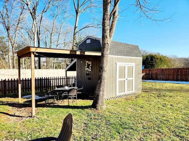 view of outbuilding featuring a lawn