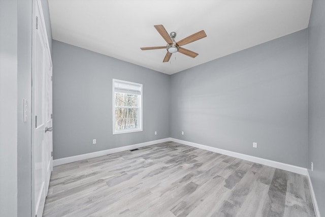 unfurnished room with ceiling fan and light hardwood / wood-style floors