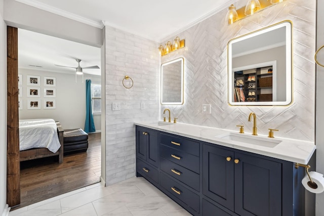 bathroom featuring ceiling fan, decorative backsplash, crown molding, and vanity