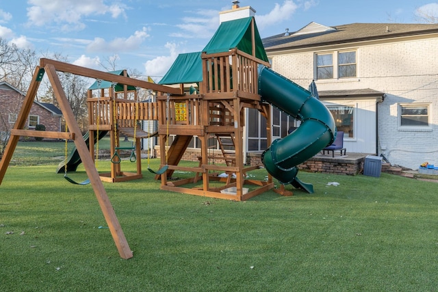 view of jungle gym featuring a lawn