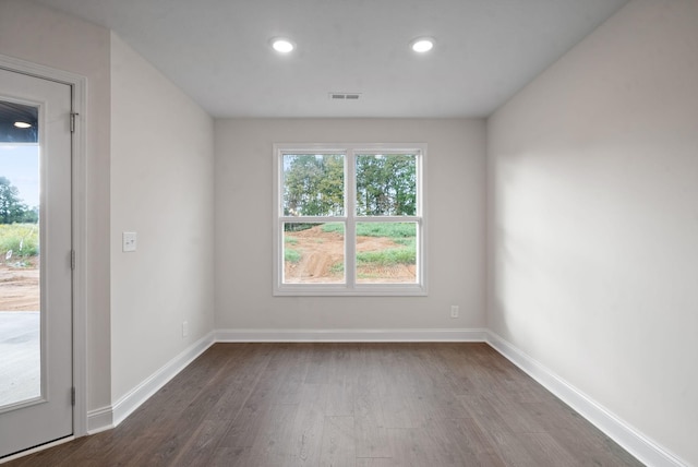 unfurnished room with hardwood / wood-style flooring