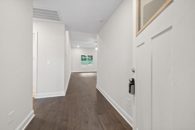 hall with dark wood-type flooring