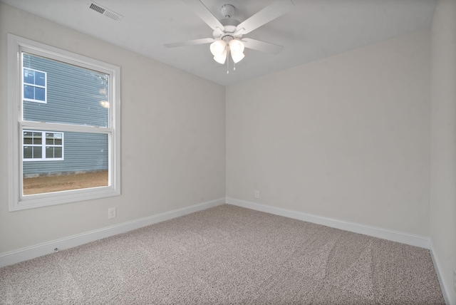 carpeted empty room with ceiling fan