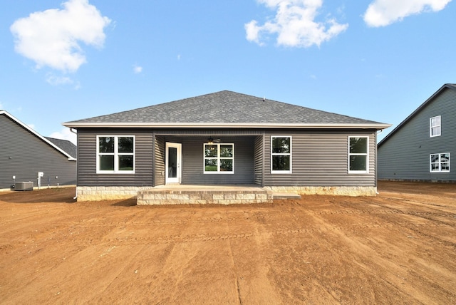 back of property featuring central AC unit