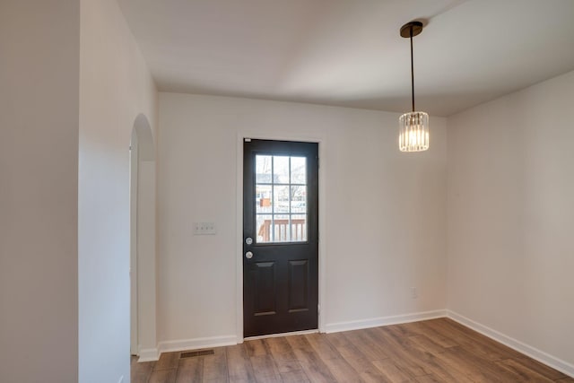 foyer with wood-type flooring