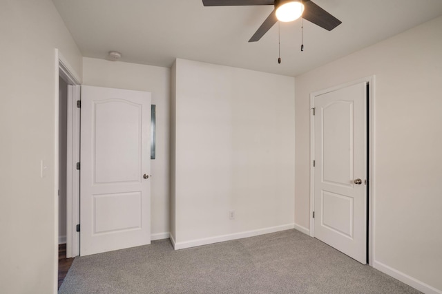 unfurnished bedroom with ceiling fan and carpet flooring