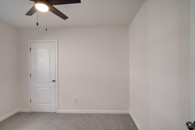 unfurnished room featuring carpet and ceiling fan