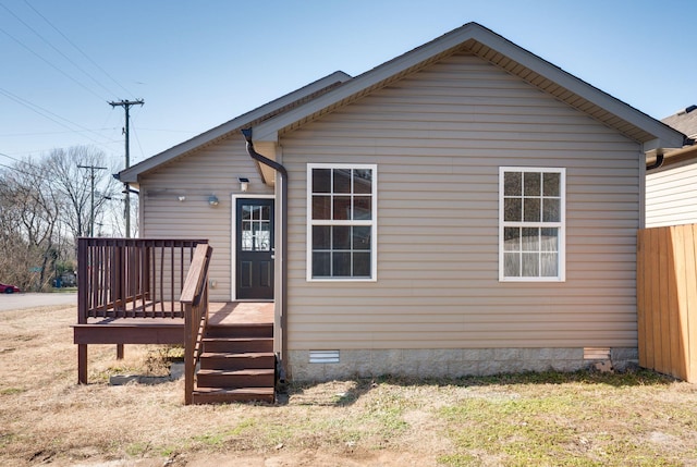 view of front facade with a wooden deck