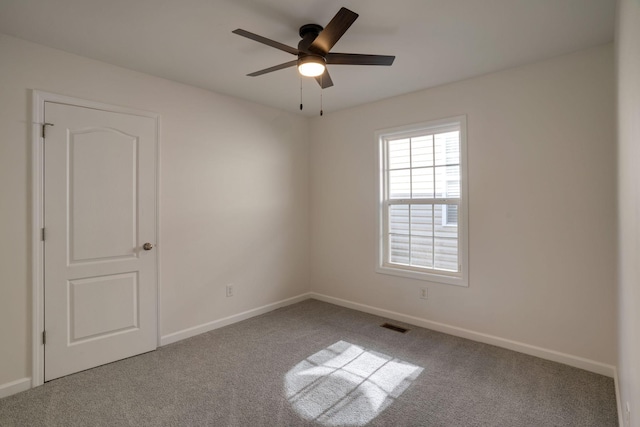 carpeted empty room with ceiling fan