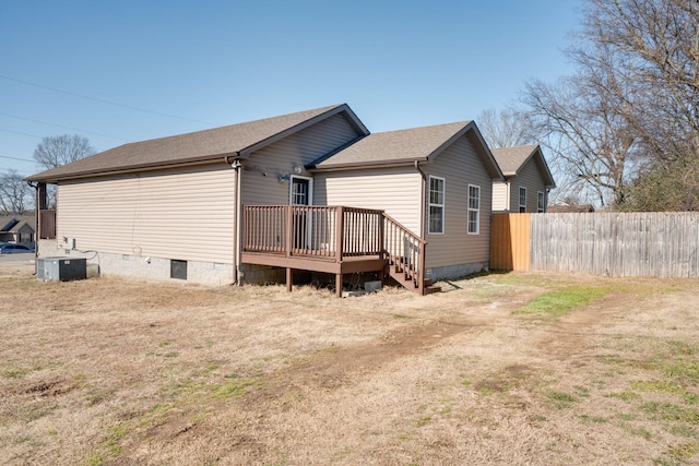 rear view of property featuring central air condition unit and a deck