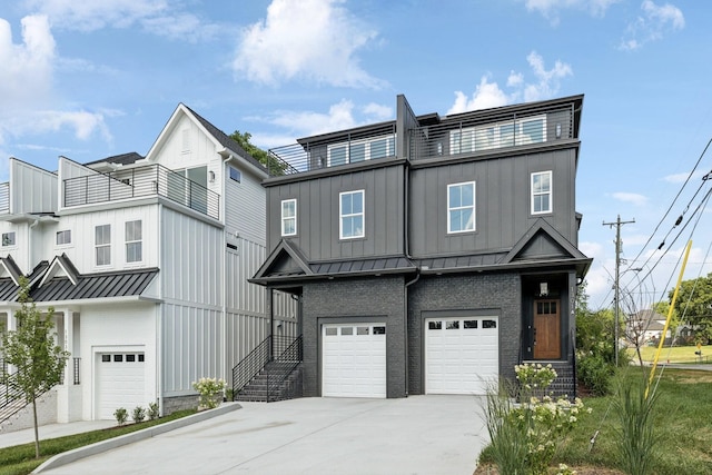 view of front of home featuring a garage and a balcony