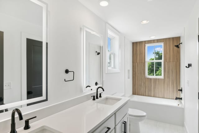 full bathroom featuring toilet, vanity, tile patterned floors, and  shower combination