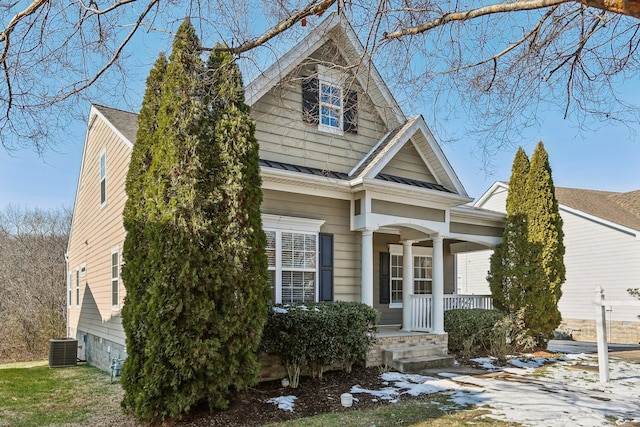 view of front of property featuring a porch and central air condition unit