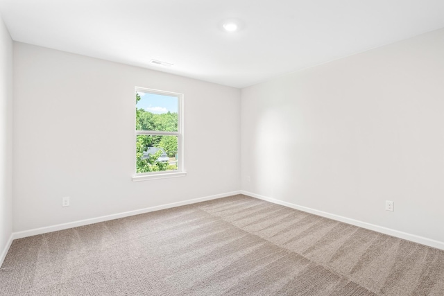 spare room with carpet floors