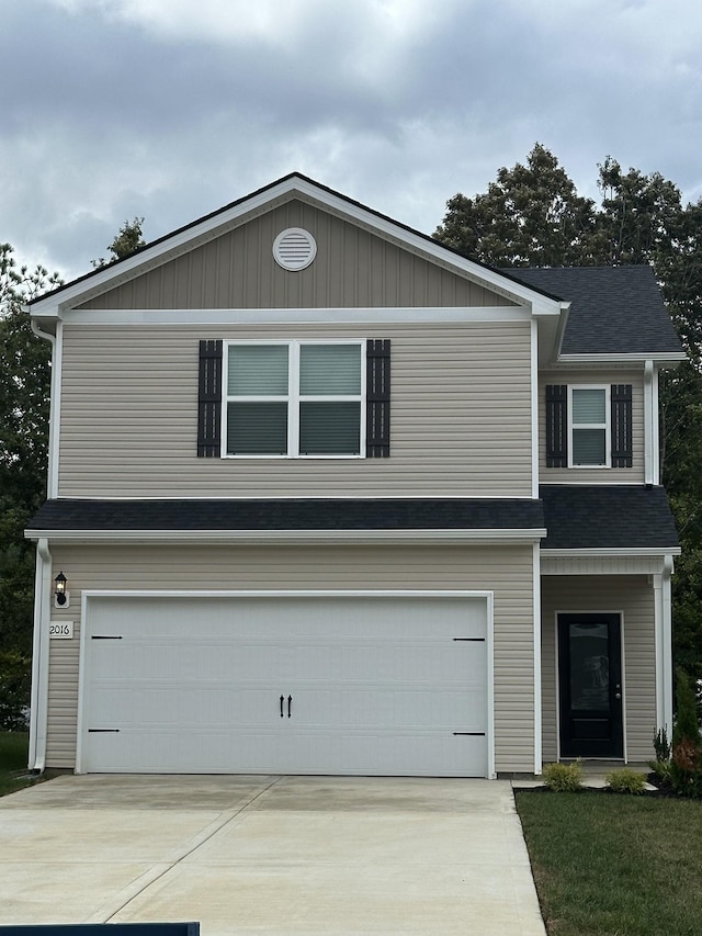 front of property with a garage