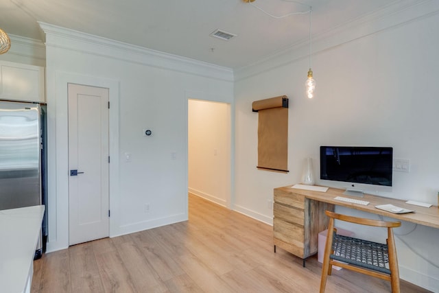 home office featuring light wood-type flooring and crown molding