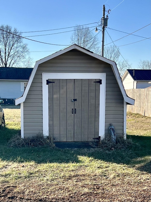 view of outbuilding featuring a yard