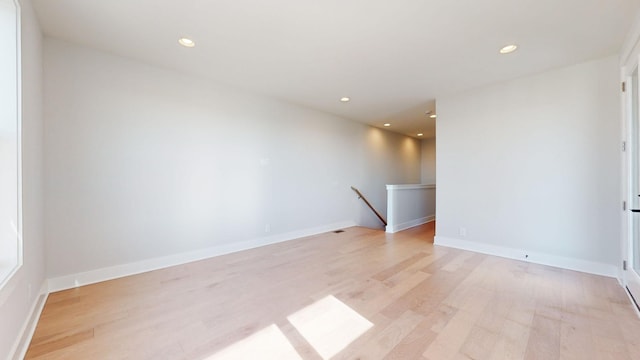 spare room featuring light wood-type flooring