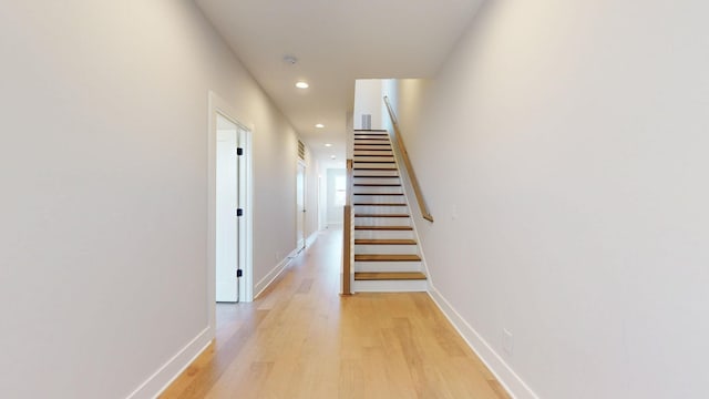 corridor with light wood-type flooring