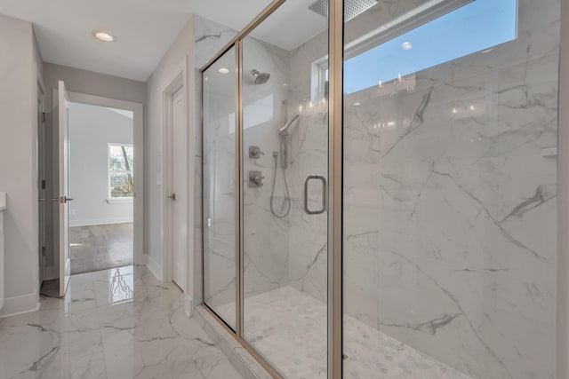 bathroom featuring an enclosed shower