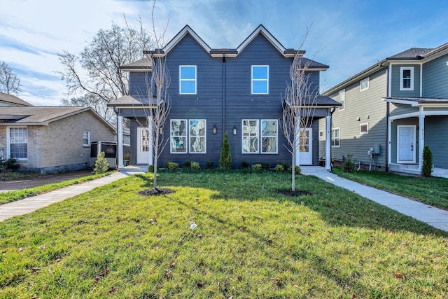 view of front of home with a front lawn