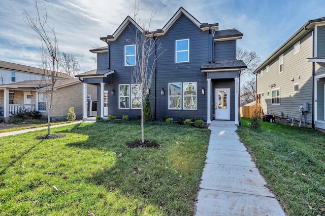 view of front of home with a front lawn and cooling unit