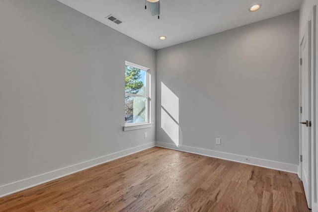 empty room featuring ceiling fan and light hardwood / wood-style floors