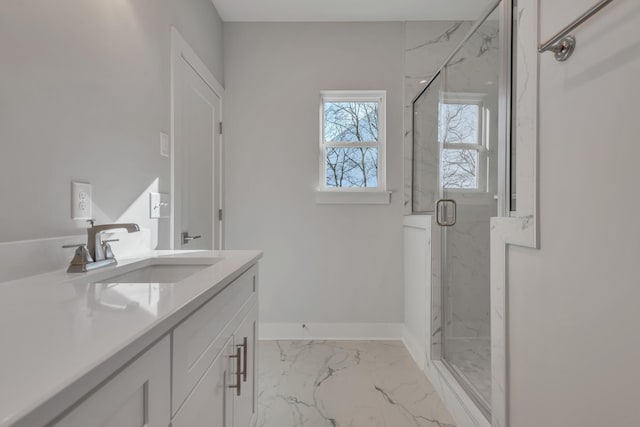 bathroom featuring an enclosed shower and vanity