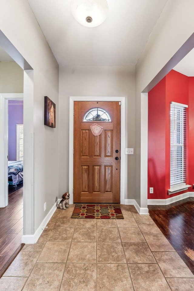 tiled entryway with plenty of natural light