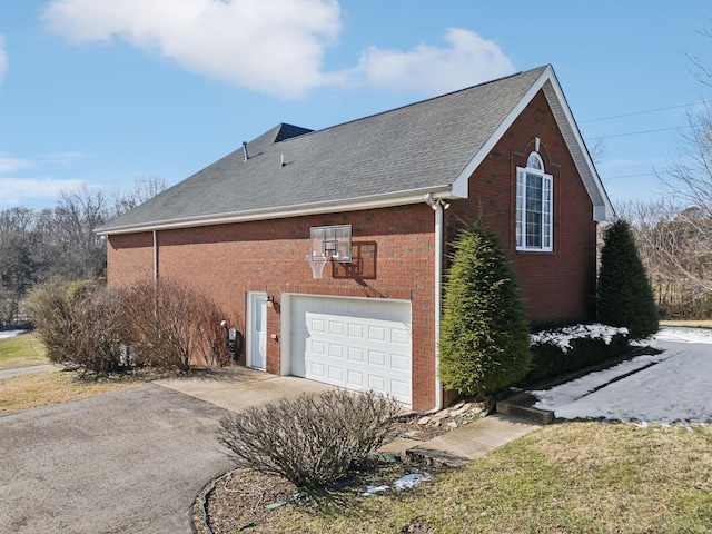 view of side of home featuring a garage