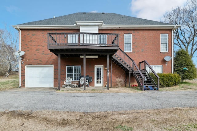 rear view of house with a garage