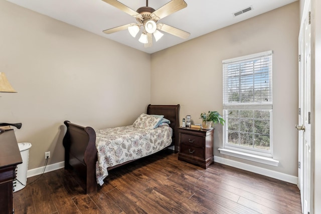 bedroom with ceiling fan and dark hardwood / wood-style floors