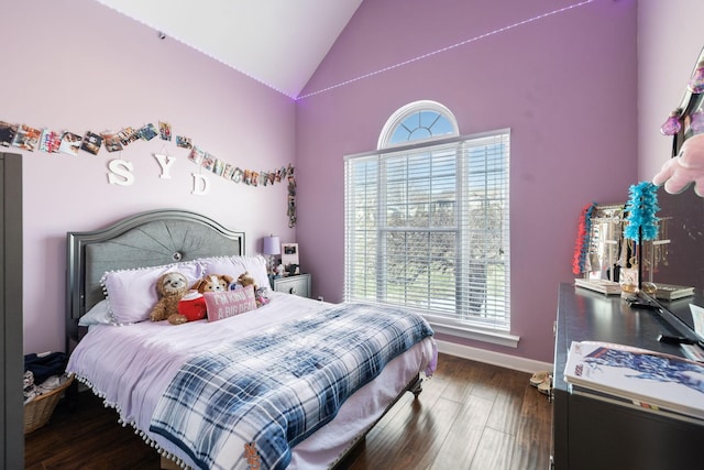 bedroom featuring vaulted ceiling and dark hardwood / wood-style flooring