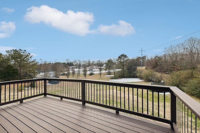 wooden terrace with a yard