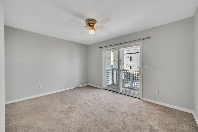 empty room with ceiling fan and carpet flooring